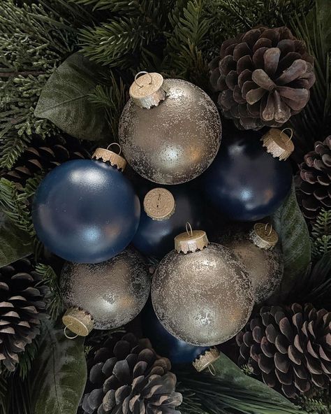 "- DESCRIPTION -  Our navy and smoky gold handmade ornament set is such a unique and trendy color combo for your Christmas tree this year. The navy ornaments are a smooth texture with a satin finish. The smoky gold ornaments are a rough \"sugared\" texture with a satin metallic finish. Each ornament will come with a matching smoky gold velvet bow to give it that added flare. All ornaments are finished with a protective coating. You can order this ornament set in a combo of both colors or in just one of the colors. Set sizes also vary. This ornament set comes in glass or shatter proof. All ornaments are 3.25 inches in diameter. - SOCIAL MEDIA - Facebook: facebook.com/ivoryandoakco1 Instagram: @theivoryandoak.co - HANDMADE NOTE -  All of our products are handmade by us with love and care. We Blue Gold Christmas Decor, Navy Ornaments, Navy Christmas Tree, Celestial Christmas, Velvet Trend, Flocked Christmas Trees Decorated, Navy Christmas, Retro Ornaments, Christmas Themes Decorations