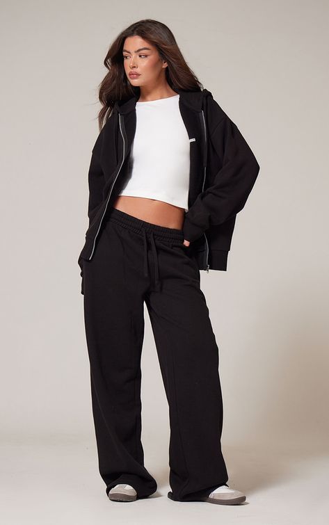 Take on your weekend the right way with these PrettyLittleThing black premium embroidered oversized wide leg joggers. Brought to you in a black premium material with an embroidered design and an oversized fit, this is everything we re loving and more. These wide leg joggers are sure to be your new go-to. To complete the look team with the matching top and your fave trainers for a look that will secure you all the likes.   Length approx 76cm/30 (Based on a sample size S)   Model wears size S Black Wide Leg Sweatpants Outfit, Black Sweat Set, Cosy Outfits, Wide Leg Joggers, Cosy Outfit, White Sweatpants, Sixth Form, Shell Suit, Basic White Tee