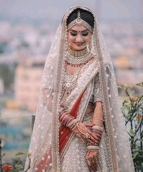 Crushing on how beautifully the beige lehenga is paired with the red dupatta and jewellery! This beautiful lehenga from @roopkalamumbai has… Red And White Lengha Bridal, Beige And Red Lehenga, White And Red Lehenga Brides, White And Red Wedding Lehenga, Red And White Bridal Lehenga, White Bridal Lehenga With Red Dupatta, White And Red Bridal Lehenga, Indian Bridal Lehenga White, Bridal Lehenga White