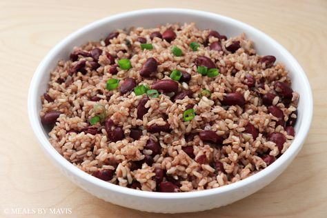 Rice and peas is a staple food in Jamaica and much of the Caribbean. This version of rice and peas uses canned beans, which makes it quicker and easier to make than dried beans. Jamaica Rice And Beans Recipe, Rice And Peas Jamaican Canned Beans, Jamaican Rice And Peas With Canned Beans, Rice And Beans Meal, Brown Rice And Peas, Caribbean Meals, Jamaican Rice And Beans, Caribbean Rice And Beans, Rice And Peas Jamaican