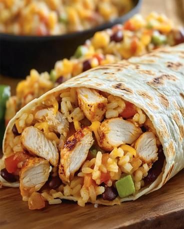 Taco Bell Chicken Burrito Recipe - Easy & Delicious Meal Taco Bell Chicken Burrito Recipe, Rice Chicken Burritos, Chicken Bean Rice Burrito, Burrito Chicken Recipe, Cheesy Bean And Rice Burrito Taco Bell, Burittos Bowl Recipes, Chicken For Burritos, Taco Bell Chicken Burrito, Meal Prep Burritos