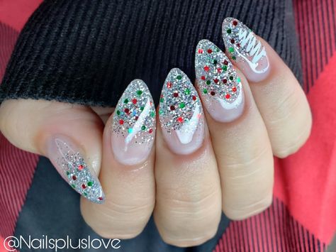 Christmas Nail Art Almond Shape, Ombre Nail Art Designs Christmas, Christmas Ombre Nails Acrylic, Silver Festive Nails, Christmas Glitter Tip Nails, Green And Silver Holiday Nails, Almond Shaped Christmas Nail Designs, Red Green Glitter Nails, Red Glitter Ombré Nails