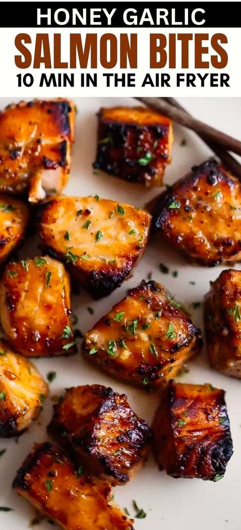 This quick and easy recipe for healthy Air Fryer Honey Garlic Salmon Bites offers succulent, bite-sized pieces of salmon coated in a sweet and garlicky sauce, cooked to perfection in your air fryer or Ninja Foodi in under 15 minutes! Make for meal prep and serve with rice, quinoa, in a stir fry, or on top of steamed vegetables! Cubed Salmon Air Fryer, Airfryer Salmon Bowl, Juicy Salmon Recipes, Crispy Salmon Air Fryer Recipes, Air Fryer Salmon Recipes Honey, Airfryer Meal Prep, Honey Garlic Salmon Air Fryer, Air Fry Salmon Recipes, Air Fry Salmon Bites