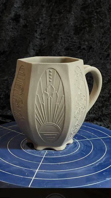 Christina Orthwein on Instagram: "My latest Art Deco Weather Mug. This is many hours of work condensed into one speedy minute. I’ve been tinkering with this design for a while. Feels good to see it together. #mugshotmonday #pottery #clay #ceramic #ceramics #handmade #mug #artdeco #art #design #weather #ChristyNockels" Ceramic Mug Handles Design, Art Deco Mug, Clay Cup Ideas Mugs, Pottery Stencils Ideas, Surface Design Ceramics, Ceramic Mug Inspiration, Carved Ceramic Mugs, Art Deco Ceramics, Ceramic Handles Ideas