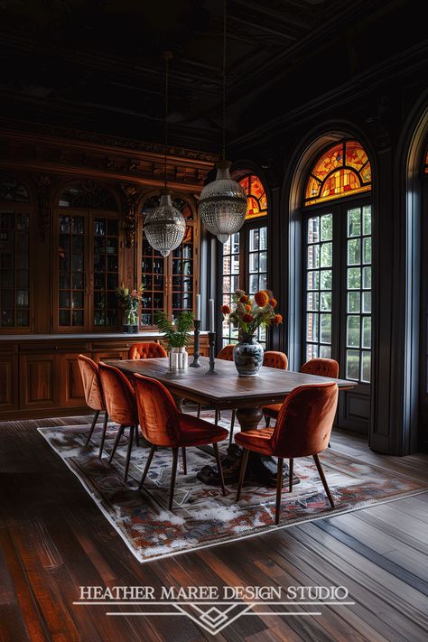 This stunning dining room exudes warmth and elegance with its rich, dark wood tones and vibrant orange velvet chairs. The intricate stained glass windows cast a beautiful light into the room, highlighting the crystal chandeliers and the carefully arranged floral centerpiece | Retro Aesthetic | Eclectic Decor | Room Inspo | Moody Aesthetic | Dark Academia | Home Decor | Vintage Aesthetic | dark home decor Dark Floral Dining Room, Light Academia Dining Room, Dark Academia Dining Room, Dining Room Floating Shelves, Modern Luxury Dining Room, Dining Room Table Farmhouse, Dining Room Centerpiece Ideas, Dining Room Ceiling Design, Accent Wall Dining Room