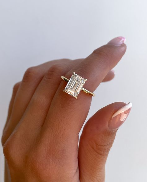 Shopping tip: Prioritise clarity when shopping for an ✨emerald cut✨ stone. ⁠ Due to their step-cut faceting pattern, inclusions can be more visible to the naked eye.⁠ ⁠ We recommend VS1 and above 🤍 ⁠ ⁠ ⁠ Ring Details:⁠ Alice Emerald Solitaire with Hidden Halo⁠ 3.1ct | E | VS1⁠ 2 5 Carat Emerald Cut Engagement Ring, Emerald Cut Cathedral Setting, Emerald Shaped Engagement Ring, Elongated Emerald Cut Engagement Ring, Emerald Engagement Ring Hidden Halo, Elongated Emerald Engagement Ring, Step Cut Engagement Ring, Emerald Cut Wedding Rings, Wedding Ring Goals