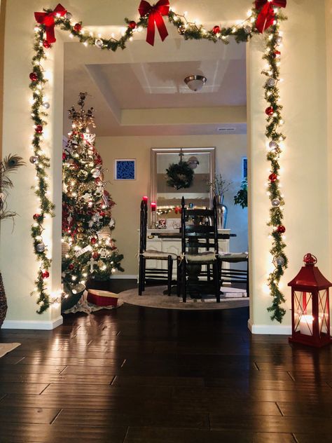 Garland Christmas Door, Christmas Garland Wall Decor, Garland Over The Door, Garland On Door Frame, Doorway Decor Christmas, Garland Archway Christmas Outdoor, Christmas Decor Open Floor Plan, Garland On Doorway, Christmas Decor Ideas Red And Silver