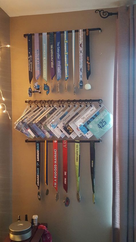 Running medal and bib display Bmx Trophy Display Ideas, Triathlon Medal Display Ideas, Display Running Bibs, Track Bib Display, Runners Bib Display, Bib And Medal Display, Medal Award Display, Ideas For Medals Display, Ribbon Medal Display