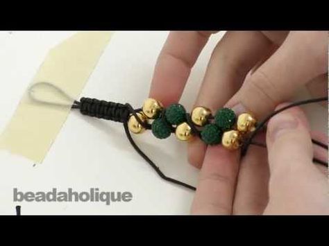 http://www.beadaholique.com/yt - In this video, learn how to make a zig zag double row Shambhala style bracelet using waxed cotton cord, 10mm round beads, and macrame knotting.    Designer: Megan Milliken    How to Make a Shambhala Bracelet, Part I: Macrame Square Knots  http://www.beadaholique.com/t-video-How-To-Make-Macrame-Square-Knots.aspx?utm_so... Double Row Bead Bracelet Diy, Double Beaded Bracelet Diy, Macrame Videos, Macrame Square, Beaded Bracelet Diy, Macrame Square Knot, Shambala Bracelet, Macrame Bracelet Tutorial, Kumihimo Patterns