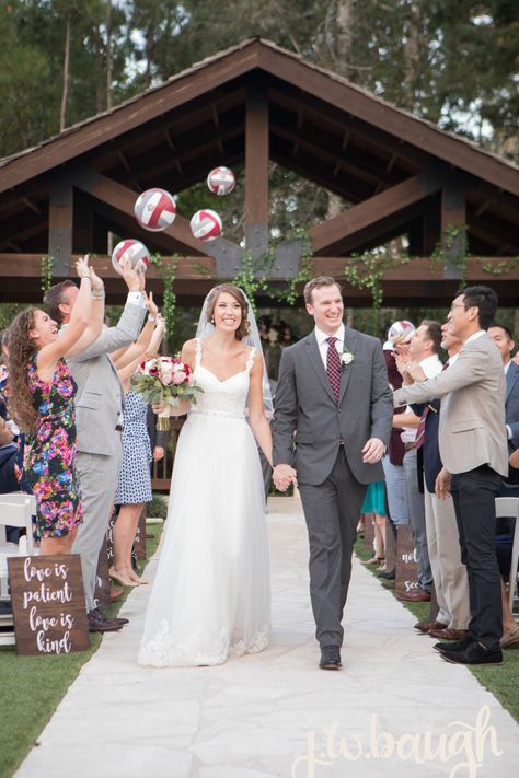 | unique wedding ceremony ideas | the bride was a volleyball player, so after their ceremony the guests tossed volleyballs up in the air | personalized wedding ideas | outdoor wedding ceremony ideas | weddings in houston | photo taken at THE SPRINGS Event Venue. follow this pin to our website for more information, or to book your free tour! SPRINGS location:  Stonebrook Hall in Lake Conroe, TX photographer:  J.W. Baugh Photography #brideandgroom #weddingceremony #weddingideas #weddinginspiration Volleyball Engagement Photos, Wedding Volleyball, Volleyball Wedding, Sporty Wedding, Personalized Wedding Ideas, Outdoor Wedding Ceremony Ideas, Soccer Wedding, Unique Wedding Ceremony Ideas, Wedding Ideas Outdoor