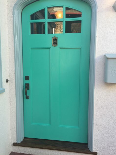 My new front door--painted Ben Moore Persian Green. Hardware is original to our 1930 Craftsman--with a sweet little speakeasy found by a contractor friend at another job site. Love the deep turquoise green door against the off white stucco. Makes me smile every time I see it. Persian Green, Painted Door, Door Jamb, Deep Turquoise, Painted Front Doors, Green Door, Kitchen Cabinet Doors, Victorian House, Kitchen Redo