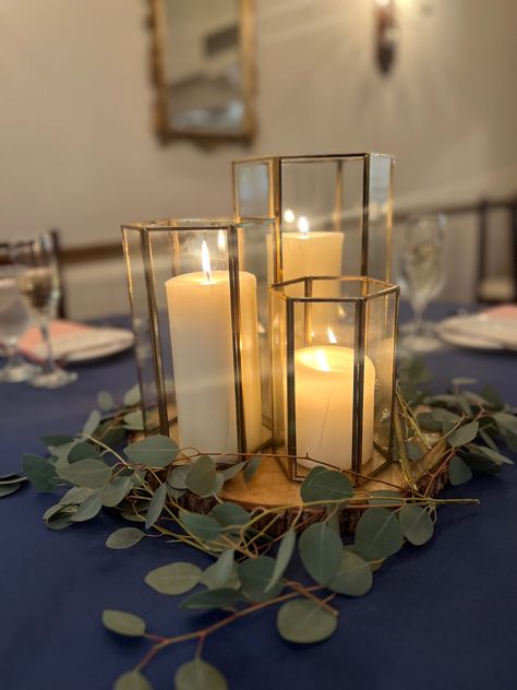 #centerpiece #wedding #lanterns #gold #blue #navy #tablescape #eucalyptus Navy Gold Eucalyptus Wedding, Navy Blue Wedding Centerpieces Diy, Navy And Eucalyptus Wedding Decor, Navy Blue White And Gold Centerpieces, Navy Blue And Green Wedding Decorations, Navy And Gold Wedding Decorations, Navy Blue And Sage Green Wedding Centerpieces, Navy Blue And Sage Green Wedding Table Decor, Navy Blue And Gold Wedding Centerpieces