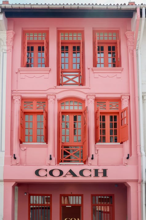 Keep an eye out for the Coach Play Singapore Shophouse as you stroll down Keong Saik Street. Easily recognizable, it is a three-story building freshly painted in a bold pink colour. If you’re wandering down Keong Saik Street, don’t miss the Coach Play Singapore Shophouse. You can’t miss it – it’s a three-story building that’s been painted a vibrant pink. It’s definitely a standout on the street. If you’re in the market for some unique shopping o... Pink Hotel Aesthetic, Singapore Aesthetic, Singapore Shophouse, Singapore Shopping, Pink Restaurant, Singapore House, Store Facade, Pink Building, Cottage Details