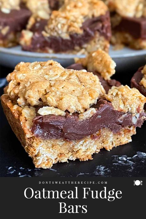 These oatmeal fudge bars are a decadent dessert that is a layer of rich and creamy fudge sandwiched between two layer of soft and chewy oatmeal cookies. Oatmeal Fudge Bars Recipes, Christmas Gift Treats, Oatmeal Cookie Bars Recipes, Oatmeal Fudge, Soft And Chewy Oatmeal Cookies, Chewy Oatmeal Cookie, Oatmeal Fudge Bars, Gift Treats, Snickerdoodle Bars