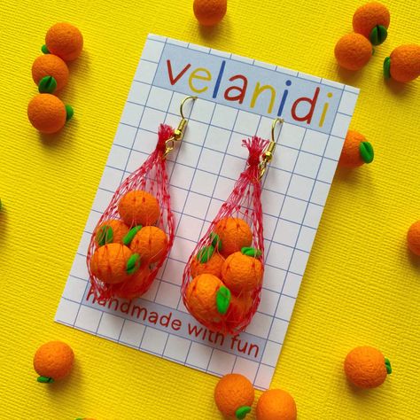 handmade earrings inspired by a trip to your local farmer's market. each earring is handmade with clay fruits or veggies, all contained in a recycled, hand sewn mesh bag Silly Earrings, Closet Refresh, Crazy Earrings, 2023 Wishlist, Weird Jewelry, Quirky Earrings, Funky Earrings, Produce Bags, Funky Jewelry