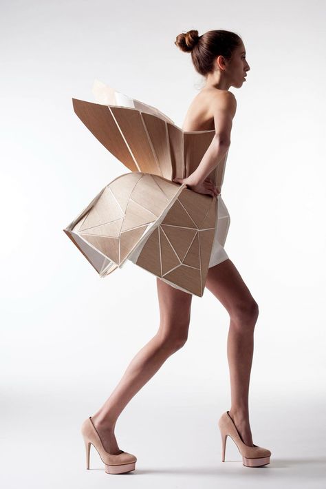 This origami dress reminds me of a peacock. I want to know what the materials they used are... Shape Project, Wearable Architecture, Tattoos Celebrities, Outdoors Quotes, Structured Fashion, Architectural Fashion, Paper Dresses, Origami Architecture, Wearable Art Fashion