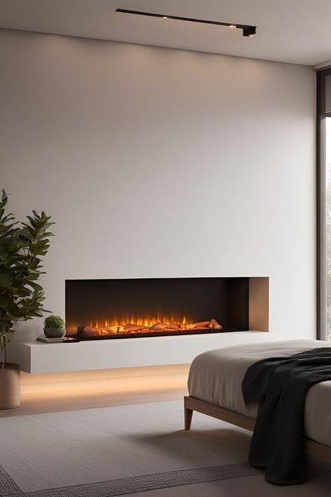 Bedroom with a cozy electric fireplace, stylishly integrated into decor, perfect for both small and guest rooms. Bedroom Fireplace Electric, Electric Fireplace In Bedroom, Modern Electric Fireplace Ideas, Bedroom Primary, Electric Fireplace Bedroom, Electric Fireplace Ideas, Fireplace Options, Media Electric Fireplace, Corner Electric Fireplace