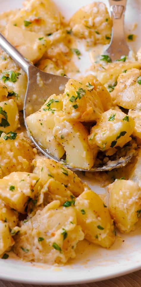 Creamy garlic potatoes on a white plate Dinner Sides Potato, Potato Recipes For Steak Dinner, Creamy Garlic Potatoes In Oven, Creamy Oven Potatoes, Creamy Diced Potatoes, Creamy Cheese Potatoes, Creamy New Potatoes Recipes, Potatoes On The Stove Top, Garlic Patotoes