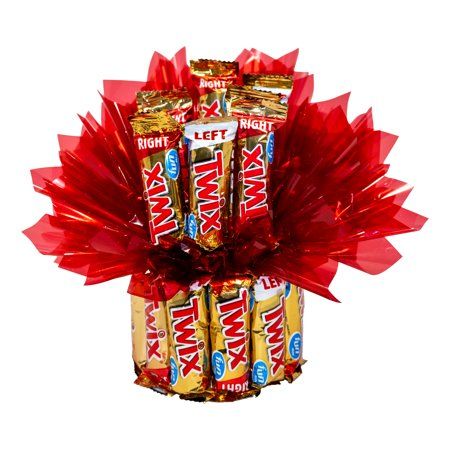 Twix snack size candy bouquet embellished with decorative cellophane. Made when you order to ensure quality and freshness. Unique and creative candy bouquets made by our professional chocolate florists. Size: 9" x 8" x 8". Candy Bar Bouquet Diy, Small Candy Bouquet, Twix Candy Bar, Bar Arrangement, Twix Candy, Candy Bar Bouquet, Kids Halloween Gifts, Pick A Side, Candy Bouquets