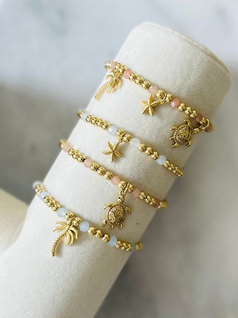 - This summer bracelet is for all the beach bums! This is the perfect beach charm bracelet for you! The cutest 18k gold filled and gemstone charm bracelet. Choose between a starfish, sea turtle or palm tree. Not sure which one? Choose your own and gemstone color too! Makes a super cute gift for that summer lover. Coordinating anklets and rings in shop. Bracelet is beaded on high quality stretch cord. - Please enter charm choice in personalization box - 4mm 18k gold filled beads   4mm sunstone an Beach Charm Bracelet, Parfum Victoria's Secret, Beachy Bracelets, Charm Bracelet Gold, Gold Beach, Preppy Jewelry, Starfish Bracelet, Summer Bracelet, Armband Gold