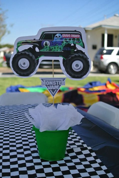 Hand made grave digger centerpiece Grave Digger Centerpiece, Grave Digger Pinata, Monster Jam Centerpieces, Grave Digger Birthday Cake, Grave Digger Birthday Party, Monster Truck Theme Birthday Party, Party Centerpiece Ideas, Festa Monster Truck, Monster Jam Birthday Party