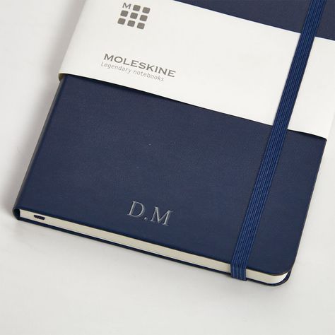 This dark blue personalised moleskine notebook is the perfect addition to any office. Sleek and simple design which can be personalised making it an ideal gift for any worth recipient. With 3 personalisation options including embossed, gold embossed, and silver embossed, personalise with up to 7 characters. These premium quality A5 moleskine notebooks have a hard cover with a smooth finish. The notebook has 240 ivory-coloured lined pages made from acid free paper, a ribbon bookmark and elastic c Personalised Money Box, Parker Jotter, Parker Pen, Moleskine Notebook, Hubby Love, Prussian Blue, Ribbon Bookmarks, Personalized Notebook, The Notebook