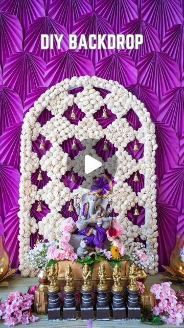 Vishnu Priya on Instagram: "DIY Backdrop using cardboard
Recently I created a backdrop for my festive home decoration and created this large cardboard cutout and added flowers to make my purple and white backdrop the backdrop I made turned out amazing 🤩 If you want a list of all the items I used to make this backdrop comment ‘purple backdrop’. In today’s reel, I’m sharing how I made this flower backdrop. I bought tri-fold cardboard from @michaelsstores 

I hope you enjoyed watching this DIY and got some Ideas for your next home projects.

Comment and let me know how you liked it 
Please share it with your friends and family, FOLLOW for more 

[ How to make cardboard backdrops, DIY backdrop, Indian Festival Backdrops, Diwali Backdrop Decoration, Diwali Decorations at home, Simple decoratio Simple Decoration Ideas At Home, Purple And White Backdrop, Golu Decoration Ideas, Diwali Backdrop Ideas, Diy Diwali Decorations At Home, Diwali Backdrop, Vishnu Priya, Purple Backdrop, Diwali Decorations At Home