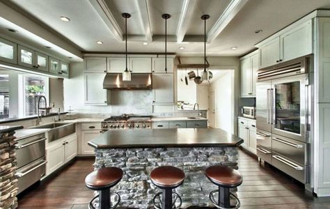 Gourmet chefs kitchen with high end appliances and breakfast bar with bar stools Kitchen Island Materials, Chefs Kitchen Design, High End Appliances, Gourmet Kitchen Design, Log Home Kitchens, Amazing Kitchens, House Aesthetics, Major Kitchen Appliances, Ranch Kitchen