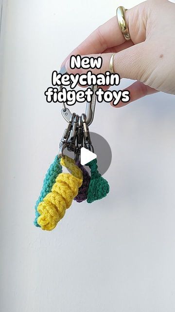 Loui Mitchell on Instagram: "🔑✨KEYCHAIN FIDGETS✨🔑

I've been making the Pushit keychain fidget for a while now, but I've been requested to make a variety of keychain fidgets, so here we are!

-Pushit (marble inside to push up and down)
-Twirlit (twisted yarn fun to stretch and twirl)
-Popit (similar to a mini dimple)
-Squishit (like a stress ball, mine is filled with popcorn kernels!) 

TESTER CALL OUT NOW, PATTERNS AVAILABLE SOON! 😅

#crochet #fidgettoy #marblepusher #pushit #twirlit #popit #minidimple #squishit #stressball #keychain" Diy Fidget Keychain, Fidget Keychain Diy, Crochet Marble Fidget, Fidgets Diy, Crochet Fidget, Popcorn Kernels, Crochet Keychain, Diy Keychain, Fidget Toys