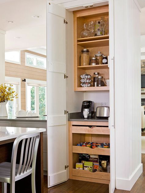 Turn a small stretch of wall into a hardworking breakfast station. Use cabinet doors to help it blend into the kitchen. Use open shelves to keep creamers, coffee beans, cereals, mugs, and juice pitchers within reach. A small countertop near electrical outlets is the perfect spot to house a coffeepot and toaster. Heavy-duty pullout drawers at the bottom can hold muffin mixes, cereal boxes, and heavy canned goods. Tall Kitchen Pantry Cabinet, Walk In Pantry Ideas, Simple Kitchen Cabinets, Kitchen Pantry Cupboard, Tall Pantry Cabinet, Open Pantry, Pantry Cupboard, Small Pantry, Large Pantry