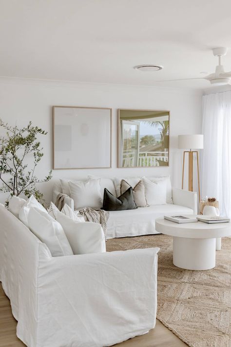 These Living Rooms Will Inspire You to Take the Plunge on a Winter White Sofa White Couch Interior Design, Coastal White Living Room, Lounge Room Art, Modern Coastal Coffee Table, Large Lamps Living Room, Open Wall Decor Living Room, White Table Lamp Living Room, White Couches Living Room Decor, White Coastal Living Room