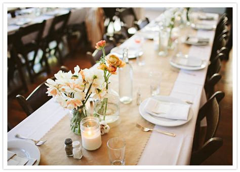 Brown paper table runner & simple florals in recycled bottles, jars and vases Kraft Paper Wedding, Paper Tablecloth, Paper Table Runner, Bottle Centerpieces, Paper Table, Wedding Table Flowers, 100 Layer Cake, White Table Cloth, Trendy Flowers