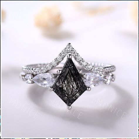 Choose the perfect symbol of love from Amazon's engagement ring collection. Unique Engagement Rings Black Opal And Silver, Black Wedding Ring Set For Women, Unique Wedding Ring Sets For Women, Kite Cut Engagement Rings, Emo Engagement Rings, Obsidian Wedding Rings, Goth Wedding Rings, Dark Engagement Ring, Witchy Engagement Ring