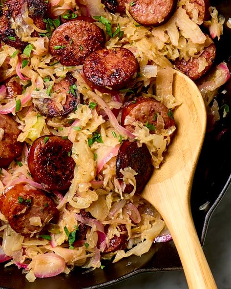 Kielbasa and Sauerkraut Recipe (4 Ingredients) | The Kitchn Kielbasa Skillet, Kielbasa And Sauerkraut, Sausage And Sauerkraut, Sauerkraut Recipe, Parsley Leaves, Homemade Sauerkraut, Kielbasa Sausage, Sauerkraut Recipes, One Pan Dinner