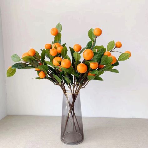 PRICES MAY VARY. PACKAGE INCLUDE: 2 pcs 25.6 inch/65cm long artificial tangerine stem. Each fake stem has 2 branch and 6 oranges fruits. HIGH QUALITY MATERIAL: These artificial oranges are made of foam material, each leaf is made of plastic, and the bright colors make them look realistic, each artificial stem is made of iron, which is strong and durable. DECORATIONS FOR HOME: Lifelike tangerine decor is perfect as centerpieces for dining room table, living room, kitchen, coffee table, office tab Orange Branch, Orange String Lights, Flower Props, Vase With Branches, Table Centerpieces For Home, Fake Fruit, Artificial Fruit, Flower Vase Arrangements, Fruit Plants