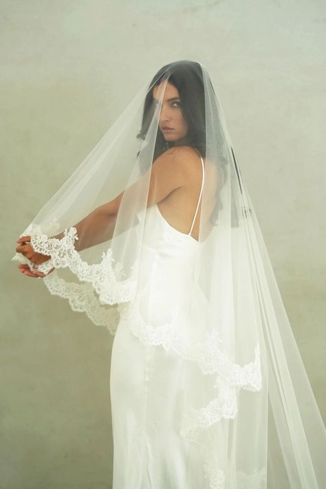 CHARLOTTE II - Drop Veil, Two Tier Lace Wedding Veil MADE TO ORDER * Handmade - all sales are final * Allow 4 - 6 weeks for production VEIL STYLE * Two-tier veil with corded lace trim * The veil is attached to a 3.5"/8.5cm wide metal wire comb VEIL SIZE * Chapel length 90"/228cm (shown)   * Cathedral 120"/308cm  TULLE * This veil is made with premium bridal illusion tulle COLOUR * Available in soft white (natural white) and ivory (warm white) * Need a tulle swatch? Order one here: https://www.et Vail Covering Face, Ruffled Wedding Veil, Modern Mantilla Veil, Long Blusher Veil, Long Veil With Blusher, Lace Wedding Dress And Veil, Boho Veils Bridal, Two Tier Cathedral Wedding Veil, Veil Attached To Dress