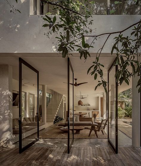 In the beautiful town of Tulum, Mexico, CO-LAB Design Office has built this summer house with concrete blocks and exterior walls finished with polished white cement... Tropical House, Tulum Mexico, Tropical Houses, Glass Doors, House Inspo, Dream Home Design, Living Design, 인테리어 디자인, Tulum