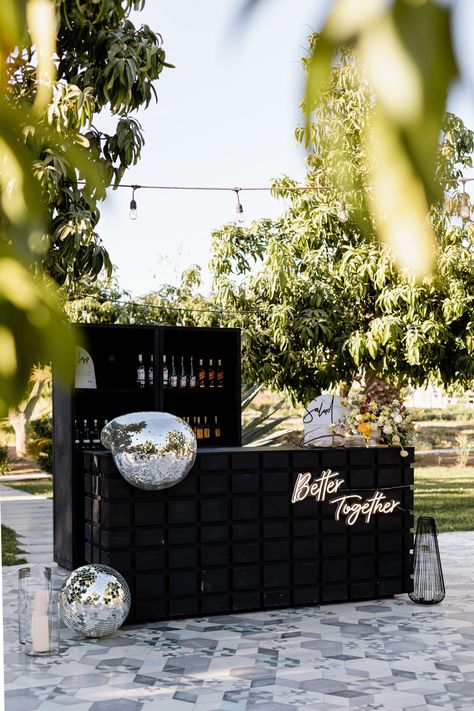 Black Outdoor Bar With Neon Sign in Garden Under String Lights, Melted Disco Balls Disco Ball Wedding, Foodtrucks Ideas, Cocktail Decoration, Opulent Wedding, Black Gold Wedding, Disco Theme, Garden Reception, Ball Wedding, Gold Wedding Decorations