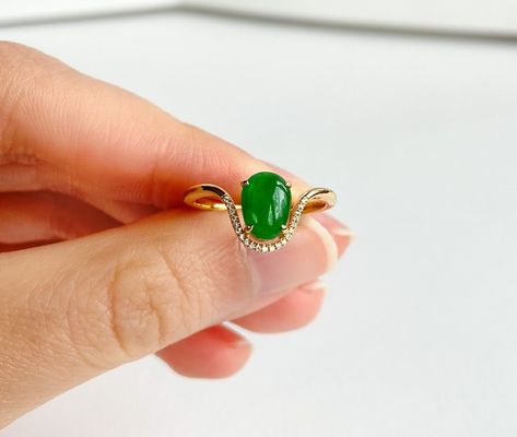 This ring is made out of top quality Burmese grade A imperial jade, diamonds and 18k yellow gold. The design is very contemporary and unique. Different from a traditional engagement ring, the band drew out of the jadeite by looping half around the gemstone. The color is also this dark but translucent emerald color very special.  we currently carry two sizes 6.5 and 5.75  Each ring has a certificate from Shanghai, where it is handcrafted. Jade Ring Design, Traditional Engagement Ring, Imperial Jade, Traditional Engagement, Yellow Gold Engagement Ring, Traditional Engagement Rings, Emerald Color, Yellow Gold Engagement, Jade Ring