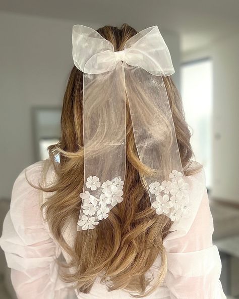 Our Grace Organza Bow in Pearl White is timelessly beautiful and adds a touch of elegance and a delicate look. Small floral details and tiny crystals are hand sewn onto the ends of the bow. This meticulous process ensures that each appliqué is perfectly placed to increase the durability and longevity of the bow, while also creating a subtle shimmer and shine that catches the light with every movement. Whether you're looking for a unique accessory for your wedding or bachelorette party, attending Bridgerton Ball, Tulle Hair Bow, Tulle Hair Bows, Hair Bow Ribbon, Ribbon Hair Clip, Organza Bow, Tulle Bow, Tulle Bows, Bow Ribbon