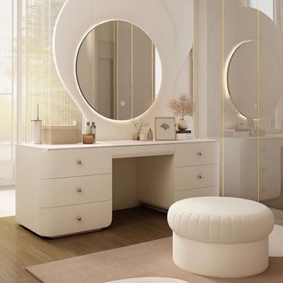 Unveiling elegance and functionality, our premium dressing table is a must-have for any vanity. With its sleek milk-white finish and sturdy hardwood frame, it embodies both style and durability. Boasting ample storage with three drawers and a hidden steel guide system for smooth operation, this dressing table is complemented by a high-definition LED makeup mirror, adjustable to three different lighting modes. Designer touches like rounded edges ensure a safe and comfortable user experience. Elev Makeup Table Storage, Vanity Ideas Bedroom Circle Mirror, Vanity Desk No Mirror, Makeup Storage Vanity, Modern White And Gold Bedroom, Room Inspo Classy, French Style Vanity, White Dressing Table With Mirror, Japandi Makeup Vanity