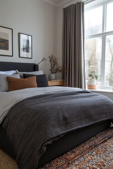 Create a romantic, neutral bedroom with these tips on how to style a gray bedroom. Dark Grey Fabric Headboard Bedroom Ideas, Grey Headboard Brown Furniture, Bedding With Dark Sheets, Grey Vintage Bedroom, Black Gray Tan Bedroom, Dark Grey Bed Decor, Bedding With Dark Grey Headboard, Grey Bed Frame Bedding, Grey Backboard Bedroom