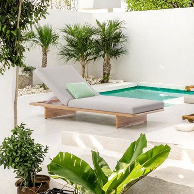 Elevate your outdoor leisure with our Teakwood Garden Sunbed, a premium choice for any villa, hotel, or garden. Designed with an enveloping seat that contours to your body, it effectively relieves hip pressure for ultimate comfort. Crafted from teakwood, it boasts anti-corrosion, crack-resistance, waterproof, and sun protection qualities, ensuring durability across all seasons. Elegance Furnishings | Elegance Furnishings Teakwood Garden Sunbed Outdoor Chaise Lounge brownWood in Light Yellow Wood