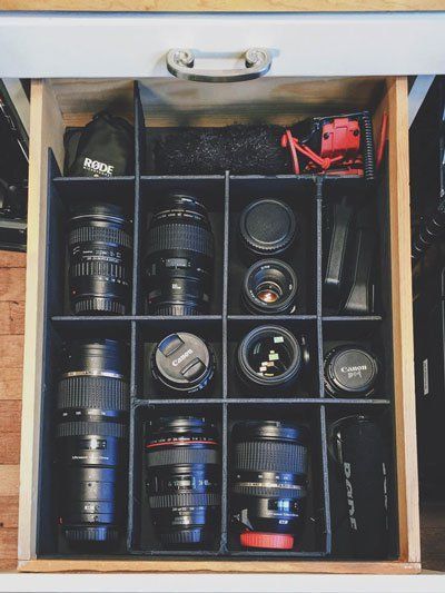 Camera equipment storage and organization - old shelf converted into easy lens and camera equipment storage by making compartmentalized spaces for each piece of gear. Photography Studio Storage, Camera Equipment Storage, Photography Equipment Storage, Camera Organization, Camera Gear Storage, Photography Storage, Camera Gear Organization, Photography Room, Studio Storage