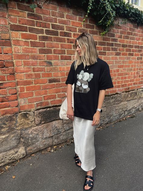 Maxi Skirt Outfit Tshirt, Uniqlo Kaws Outfit, Black Skirt Tshirt Outfit, Cream Satin Maxi Skirt Outfit, Satin Skirt Tshirt Outfit, Maxi Skirt Oversized Shirt, Midi Skirt And Tshirt, Long Skirt Tshirt Outfit, Cream Maxi Skirt Outfit