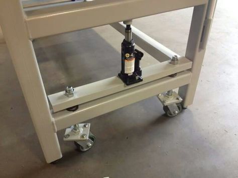 Welding table with bottle caster mechanism Retractable Casters, Welding Bench, Wood Toy Box, Image Simple, Heavy Duty Work Bench, Sewing Station, Welding Tables, Welding Shop, Welding Cart