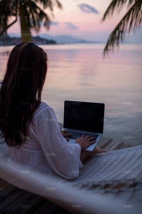 Woman working on computer at sunset by Beach Babe Stock on @creativemarket Work By The Beach, Life By The Beach Aesthetic, Working Women Pictures, Work On The Beach, Work At The Beach, Working From Beach, Working On Beach, Woman Working Aesthetic, Working Women Aesthetic