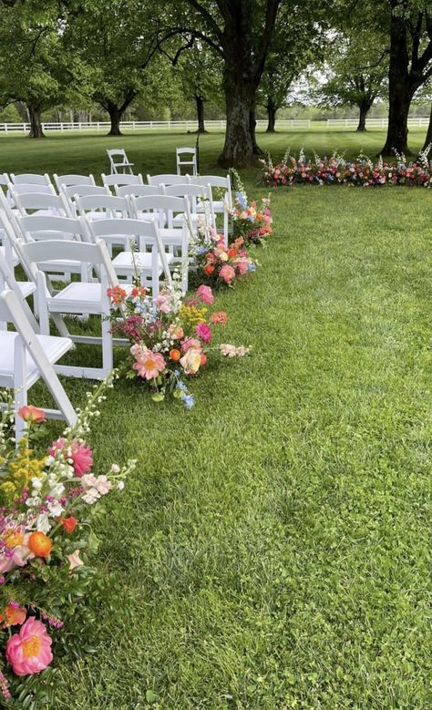 Aisle Flowers Outdoor Wedding, Colorful Wedding Isles, Summer Outdoor Wedding Ceremony, Outdoor Aisle Flowers, Wedding Ceremony Pavilion Decorations, Floral Wedding Aisle Decorations, Outdoor Wedding Ceremony Open Field, Wedding Aisle With Flowers, Wedding Ceremony Wildflowers