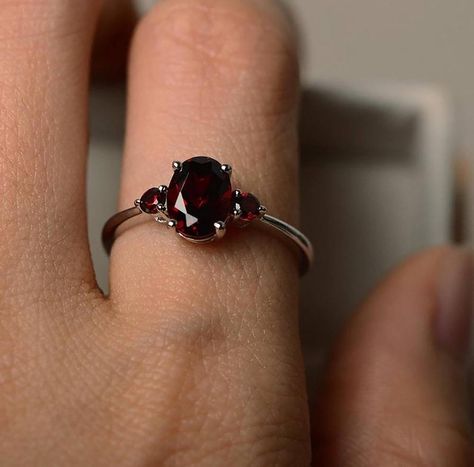 This Art Deco Oval shape garnet ring can be a good choice for engagement ring. The vintage style design makes it noble and delicate. A great gift for your loved one! Features * Made to Order. * Material: 925 Silver. * Color: Silver. * Stone Type: Natural Red Garnet.  * Stone Size: 6x8MM. * Stone Shape: Oval.  * Ready to Ship in 7-10 Business Days.  Want to find out more? Check out my shop https://www.etsy.com/shop/EARTHLYpiecesIndia Thank you for taking the time to look at my shop. I hope you en Garnet Stone Ring, January Birthstone Rings, Red Garnet Ring, Garnet Ring, Garnet Stone, Ring Oval, Garnet Rings, Three Stone Rings, Gems Jewelry