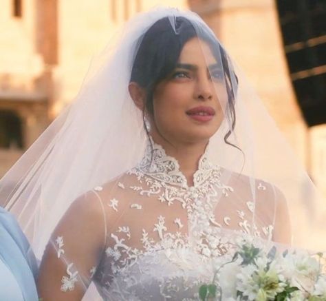 Priyanka Chopra's wedding hairstyle practically screams romance. The movie star pulled her hair back into a high updo, but she left pieces out in front for a wispy look. She topped the look off with a dramatically-long, voluminous veil. From minimalist up-dos to glamorous waves, we have hair inspo ahead for every kind of to-be-wed. See our favorite celebrity wedding hairstyles, here. Celebrity Wedding Hairstyles, Priyanka Chopra Hair, Priyanka Chopra Wedding, Celebrity Wedding Hair, Celebrity Wedding Photos, Muslimah Wedding Dress, Second Wedding Dresses, Hindu Ceremony, Celebrity Wedding